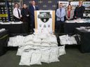 The Alberta Law Enforcement Response Team (ALERT) along with the RCMP, Calgary Police Service, Edmonton Police Service and the US Drug Enforcement display drugs seized during a press conference Wednesday.