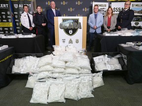 The Alberta Law Enforcement Response Team (ALERT) along with the RCMP, Calgary Police Service, Edmonton Police Service and the U.S. Drug Enforcement display drugs seized during a press conference Wednesday.