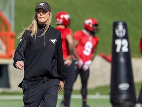 Strength and Conditioning coach Tara McNeil walks on the field during Calgary Stampeders training camp at McMahon Stadium on Monday, May 16, 2022.