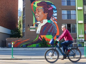 A mural of Canada's first female black lawyer Violet King by artist Curtia Wright decorates a wall along the 800 block of 12th Avenue S.W. on Thursday, September 1, 2022.