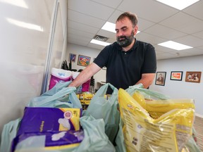 Alexander Shevalier, president of the Calgary and District Labour Council, organizes food donations during a Labour Day food drive on Monday, September 5, 2022.