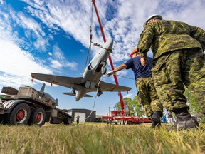 A Canadair CT-133 Silver Star or T-33 is lifted to its new home as part of the collection of the Air Force Museum Society of Alberta (AFMSA) at the Military Museums in Calgary on Wednesday, September 7, 2022.