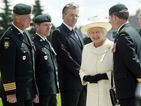 In this archived photo from 2005, Queen Elizabeth II is greeted by dignitaries as she arrives at the Museum of the Regiments in Calgary.