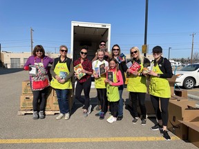 Jayman Built won BILD Alberta's Community Service Award for its support of literacy and education programs in Edmonton and Calgary. Here, Jayman staff help stuff a truck with books in support of Calgary Reads.