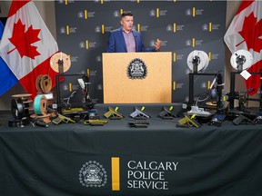 Acting Staff Sergeant Ben Lawson of the Calgary Police Service Firearms Investigative Unit shows off the 3D printed firearms that were confiscated after  66 charges were filed against two men believed to be running a firearms production and trafficking operation in Calgary. Thursday, August 25, 2022.