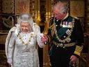 In this photo taken on Oct. 14, 2019, Queen Elizabeth II leaves with Prince Charles after delivering the Queen's Speech at the State Opening of Parliament in the Houses of Parliament in London.