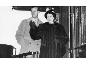 Then-Princess Elizabeth and Prince Philip wave farewell to Calgary, before boarding a train during their 1951 tour of Canada. Postmedia file photo.