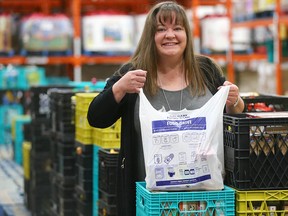 Betty Jo Kaiser, communications coordinator at the Calgary Food Bank poses at the warehouse in southeast Calgary.