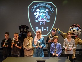Seven youth received the 911 Heroes Award in a ceremony at the Telus Spark on Friday. Each was recognized for remaining calm while calling 911 and providing details on emergencies.