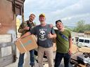 Mac Hughes, right, with father Paul and fellow volunteer Steve Rock in Zaporozhye, Ukraine.