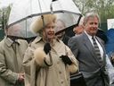 Queen Elizabeth II, accompanied by Premier Ralph Klein, visits Commonwealth Stadium in Edmonton on May 23, 2005.