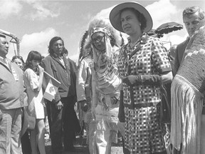 Queen Elizabeth II meets members of First Nations at Calgary Exhibition and Stampede. Also with her is the president of the Indian Association of Alberta Harold Cardinal and Premier Peter Lougheed. Calgary Herald archives.