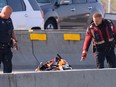 Calgary police investigate after a fatal motorcycle collision on the Calf Robe Bridge closing Southbound Deerfoot Trail on Saturday, September 10, 2022.