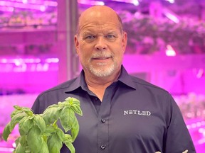 Brent Parker, director of Netled North America, with herbs grown at its Calgary vertical farming plant.