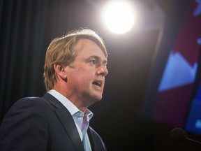 Alberta Justice Minister Tyler Shandro answers questions at a news conference, in Calgary on Friday, Sept. 3, 2021. Criminal defence lawyers escalated job action Thursday in an ongoing dispute with the provincial government over the amount of compensation paid by Legal Aid Alberta.