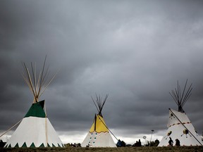 Teepees are raised at Fort Calgary on Sept. 22, 2017, to commemorate the signing of Treaty 7.