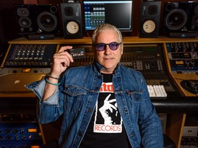 Danny Patton poses for a photo with the tape that includes three songs from Rage Against the Machine’s first album recorded in his studio, Airwaves Recording.