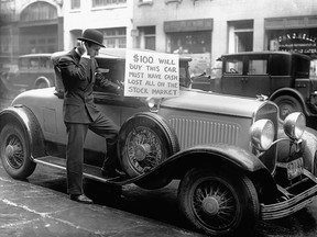 The most disastrous stock market crash of all time was on Oct. 29, 1929, which led to the Dow losing 89 per cent of its value. Pictured, bankrupt investor Walter Thornton tries to sell his luxury roadster for $100 cash on the streets of New York City following the 1929 crash. Bettmann archive/Getty Images.