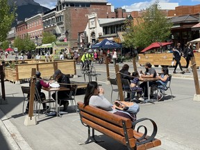Banff Avenue busy with open patios and visitors on Saturday evening in June 2021. The federal government announced Tuesday it will spend $8 million toward the restoration of the 200 block of Banff Avenue.