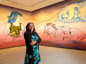 Renowned American visual artist Chitra Ganesh in front of Wolf Watcher's Dream, a site-specific mural she created at Contemporary Calgary as part of her with her new and first Canadian exhibit, Astral Dance.  Darren Makowichuk/Postmedia