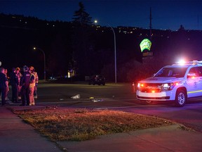 First responders at the scene of a hit-and-run involving a teenager at the intersection of 16 Ave. and 46 St. N.W. on Monday, October 17, 2022.