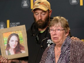 Sylvia McKenzie, mother of Angela McKenzie, accompanied by Angela’s fiancé Jeff Poirier, speaks with the media at Calgary police headquarters on Tuesday.