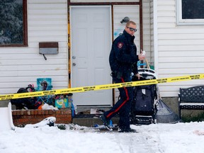 Calgary police investigate a homicide at a home in the 100 block of Rundleson Way N.E. in Calgary on Sunday, October 23, 2022.