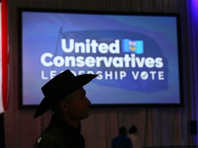 Supporters wait for ballot results at the BMO Centre in Calgary for  the UCP leadership vote on Thursday, October 6, 2022.