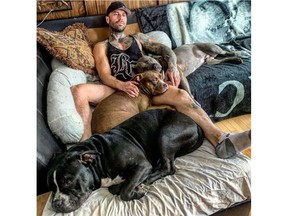 Denis Bagaric with his three Staffordshire terrier dogs in an undated photo. On June 5, 2022, Betty Ann (Rusty) Williams, 86, died after she was attacked by three dogs in a near her home in northwest Calgary.