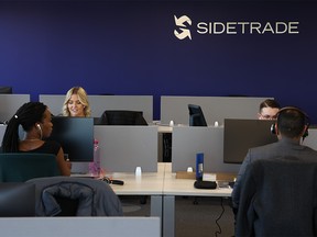 Sidetrade employees work at the firm’s recently opened Calgary office on Monday, October 3, 2022. The global AI-powered order to cash platform plans to invest $24 million and add 110 full-time jobs in Calgary over the next three years.