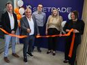 Sidetrade CEO Olivier Novasque cuts the ribbon with employees at the firm’s recently opened Calgary office on Monday, October 3, 2022. The global AI-powered order to cash platform plans to invest $24 million and add 110 full-time jobs in Calgary over the next three years.
