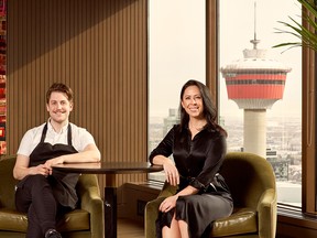 Brittany Thompson, right, the regional manager with Concorde Entertainment Group, and Concorde’s culinary director Garrett Martin, at Major Tom on the 40th floor of Stephen Avenue Place.   ELUVIER ACOSTA