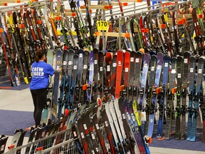 Kristin Lang helps set up for the Calgary New and Used Ski Sale which kicks off Friday at 5 p.m. at Max Bell Centre.