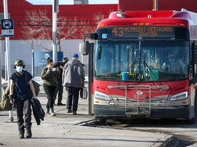 Transit users at the Chinook CTrain station's bus loop were photographed on Sunday, January 16, 2022.