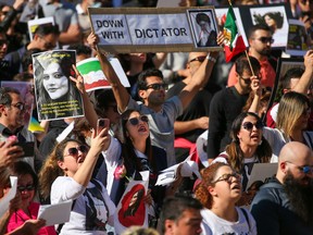 Hundreds of Calgarians rallied at City Hall to protest recent human rights violations in Iran on Saturday, October 1, 2022.