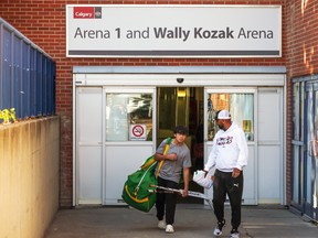 Players leave the newly renamed Wally Kozak arena at the Village Square Leisure Centre on Saturday, October 15, 2022. The City of Calgary held a ceremony Saturday to announce the renaming as well as renaming an arena at the Max Bell Centre after Perry Cavanagh. Both men were honoured for their leadership in Calgary minor hockey.