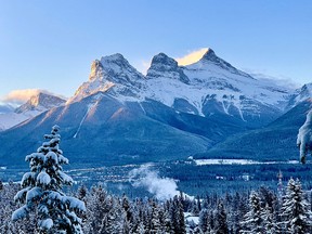 The Three Sisters mountains rise above Canmore on Oct. 30, 2021.