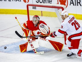 Calgary Flames goaltender Jacob Markstrom makes a save against the Carolina Hurricanes at the Scotiabank Saddledome in Calgary on Saturday, Oct. 22, 2022.