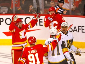 Calgary Flames forward Elias Lindholm celebrates with teammates after scoring against the Vegas Golden Knights at the Scotiabank Saddledome in Calgary on Tuesday, Oct. 18, 2022.