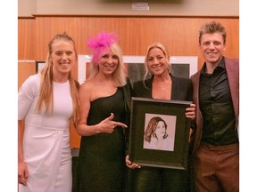 Sarah McLachlan was presented with a drawing from Oje Hart, right at the Owen Hart Foundation fundraising concert. Also shown are Athena Hart and their mother, event founder Martha Hart. Courtesy, Jamie Lamb, Owen Hart Foundation