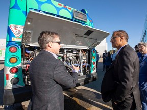 Edmonton Mayor Amarjeet Sohi is shown the city's new hydrogen bus by Chad Sadowy of New Flyer at the Electric and Hydrogen Vehicle Expo on Saturday, Sept. 24, 2022 in Edmonton. Alberta is poised to take advantage of hydrogen technology being developed, writes Robert Miller.
