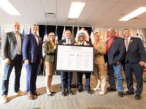 A group photo is taken after after a deal is announced  between Enbridge and 23 First Nations and Metis communities . The agreement is the largest Indigenous energy investment in North America. From left to right is Colin Gruending, Executive VP and President Liquids Pipelines, Al Monaco, President and CEO, Enbridge, Chana Martineau, Alberta Indigenous Opportunities Corporation (AIOC) CEO, former premier Jason Kenney, Greg Desjarlais, Chief of Frog Lake First Nation, Justin Bourque, President, Athabasca Indigenous Investments, Stan Delorme, Chairperson Buffalo Lake Metis Settlement and Rick Wilson Minister of Indigenous Relations. Taken on Wednesday, Sept. 28, 2022 in Edmonton. Greg Southam-Postmedia