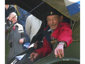 Apeldoorn, The Netherlands, May 8, 2005: Calgary's Art Grenier rides a restored wartime vehicle at the Veterans Parade in Apeldoorn. Grenier wears his PPCLI uniform under a windbreaker. David Bly's photo.