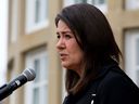 Alberta Premier Danielle Smith speaks to the media outside Government House after swearing in her new cabinet ministers, Monday, Oct. 24, 2022, in Edmonton.