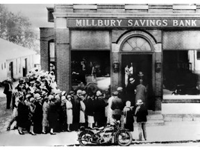 This photo from October 1929, shows people rushing to a savings bank in Millbury, Massachusetts, as the stock market crash sparked a run on banks across the United States. AFP photo via Getty Images.