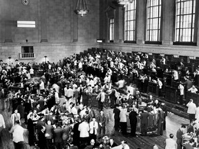 This photo dated October 1929 shows traders rushing about as the New York Stock Exchange crashed. AFP photo via Getty Images.