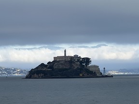 Alcatraz Island sits hauntingly in the middle of San Francisco Bay.  You can take a ferry to the Rock to visit its famous prison.  Photo by James Ross