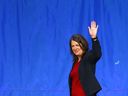 Danielle Smith waves as she leaves the stage at the BMO Center after her UCP leadership win on Thursday.