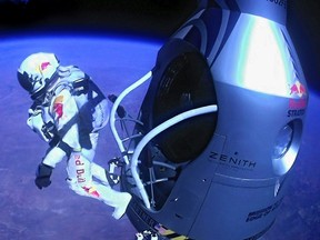 Pilot Felix Baumgartner of Austria jumps out of the capsule during the final manned flight for Red Bull Stratos on Oct. 14. The Austrian daredevil became the first man to break the sound barrier in a record-shattering free-fall jump from the edge of space, organizers said. The 43-year-old leaped from a capsule more than 39 kilometres above the Earth, reaching a speed of 1,135 km/h before opening his parachute and floating down to the New Mexico desert.