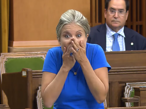 Calgary-Nose Hill MP Michelle Rempel covers up her mouth after saying the s-word in the House of Commons on Tuesday.